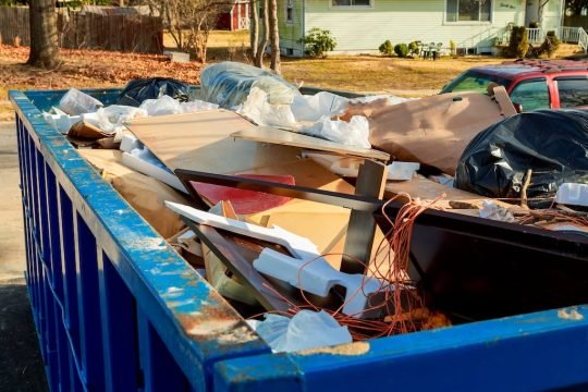 Team performing property cleanout and junk removal